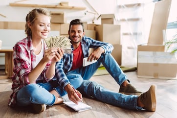 Young couple counting money